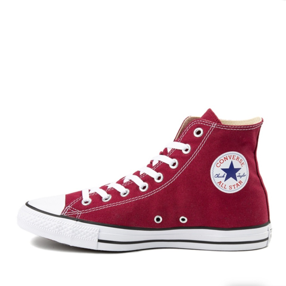 Maroon high top converse.